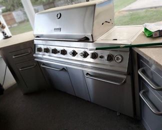 Outdoor kitchen with gas grill drawers counter tops very nice set