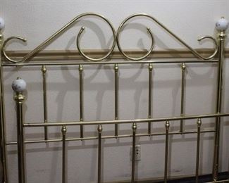Full size brass bed	
Porcelain bed knobs. Comes with frame