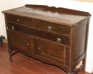 Antique Buffet	
3 drawers, 1 cabinet. One drawer pull is off - it is stored in the top drawer.