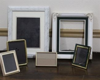 Brass and white picture frames