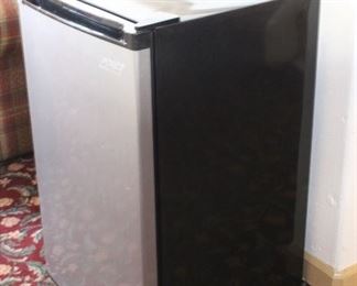 Mini Fridge	
Arctic King. Clean inside! Small drawer on bottom. Protective plastic coating is still attached - one spot is melted but the plastic covering can be removed.