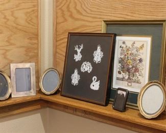 Variety of picture frames	
One has dainty crocheted figures, one has flower print. Others are empty.