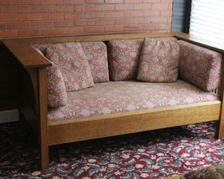 Stickley loveseat	
With floral upholstery - has fading due to sun and a couple runs. Wood piece itself is in better than good condition except back flat piece has some scratches (see photos)