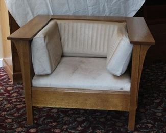 Stickley chair	
Needs to be reupholstered - white leather is sun faded and damaged by use. Wood is in good shape.