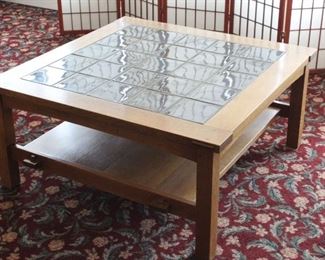 Stickley tiled top coffee table	
Slate blue tiles. Has a bottom shelf. Some scuffs towards the bottom of the legs