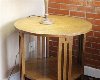 Stickley side table and lamp	
Round side table w/bottom shelf. In very good condition. Lamp needs finial.