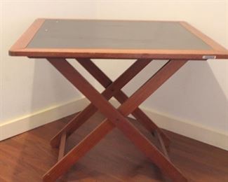 Tramontina square folding table	
Wood with laminate top. Folds flat for storage. Some separation at joints on top.