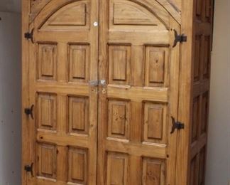Spanish style armoire	
Curved doors and bottom drawer. Cool hardware, distressed style