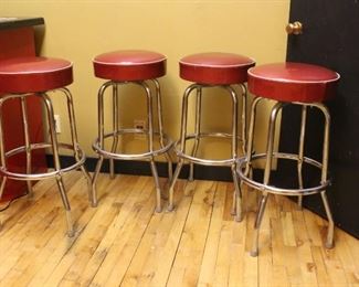 Red diner stools	
4 in lot. Chrome and sparkle red vinyl swivel top.
