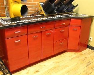 Cherry Red metal cabinet unit	
Lower cabinets/drawers/lazy susan with black and white tile top. In good shape! Pictures do not do color justice