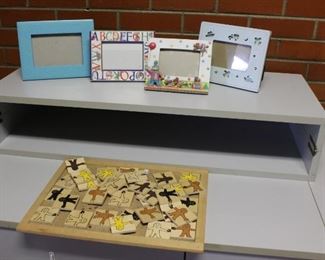 Child frames and puzzle	
4 wood, cardboard and ceramic frames. Puzzle is wood.