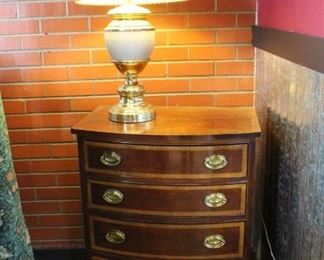 Thomasville Mahogany Collection: bedside stand and lamp	
Two tone wood with brass pulls. Top has some wear and tear. The rest is in good shape. Matches dresser in lot 64.