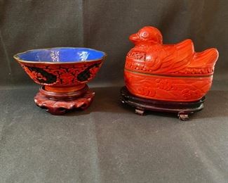 Asian Item 23	
Metal bowl red decorative outside, red decorative oval dish with duck lid both on wooden pedestals; Note: see photos