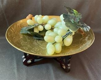 Asian Item 28	
12" dia etched Brass plate, glass grape cluster decor; on wooden pedestal; Note: see photos