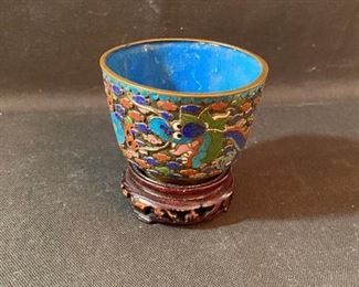 	Asian Item 33	
Metal Cloisonne 2 1/2" dia shallow bowl on wooden pedestal; Note: see photos