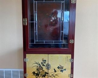 	Curio	
Glass door, lighted, 1 bulb burnt out, curio cabinet 31 1/2"w x 15 1/2" d x 67"h, includes 8 decorative locks;