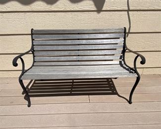 Patio bench	
49 1/2" l x 31 h wrought iron & wooden slat bench;