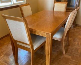 Table & chairs 2	
5 pc dinning set: 1-36" x 60" rectangular wood table & 4 cream cushion 39" h chairs, minimal wear
