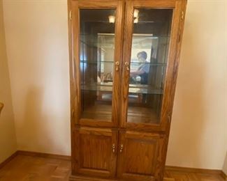 China cabinet	
35"w x 13"d x 70"h Lighted china cabinet, works, w/3 glass shelves, bottom shelving & doors;