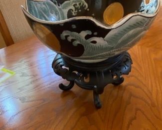 	Asian Item 53	
Ceramic 9 1/2" dia sq bowl on wooden pedestal