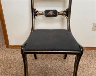 	Decorative chair	
Black lacquer painted chair with floral accents 17"x 15"x 32"