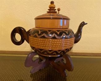 Wooden teapot on wooden pedestal; Note:  see photos