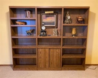 3 pc bookcase set:  each measures 28" w x 11 1/2"d x 72"h , contents on shelf sold separately.  Note:  see photos.  Heavy.  Bring help to remove and load