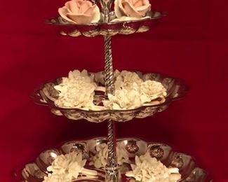Silver 3-tiered cake stand.  Shown with ceramic flower name card holders.  Stand and card holders sold separately.