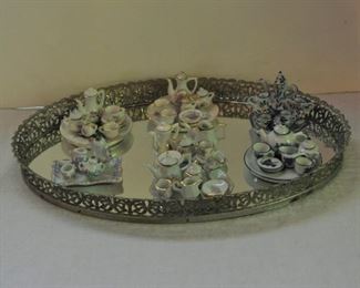 Tiny tea sets. Each $8.00, various components. Japan/Taiwan era's.    Mirrored tray $18.00.