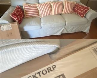 Ikea Ektorp couch in light blue cover, also comes with a brand new tan cover. Includes 6 throw pillows shown                                                                                 PRICE $ 240 or best reasonable offer                                               Ikea Ektorp couch retails for $499 with no cover