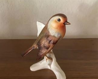 Porcelain bird on branch figurine                                                     PRICE: $4