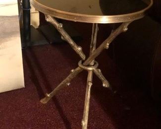 Accent Table: Heavy Brass with Black Granite Style Mirror Finish Top and Bamboo Style legs. 4 Available. 2 sold. They are sold individually.  Diameter =16.5 in  x H=21.5 in.