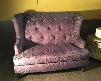 Wing-back Love seat. Upholstered in a Lavender Damask Zebra print.  (W=53in x D=34in x H=42-1/2in)