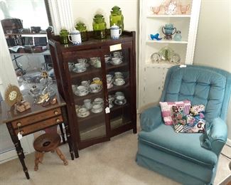 arm chair, curio cabinet, tea cups