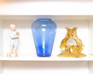 Boy on left and blue vase are sold. 