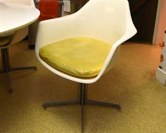Item 4: White Kitchen Table & Chairs: $375 Unmarked tulip-style 48" table (presumed to be Burke). Has four chairs, marked Burke, Inc. Yellow vinyl seat cushions are in fair condition. Two have repairs made with duct tape (what else?). White (formica?) table top is worn.