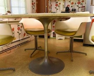 Item 4: White Kitchen Table & Chairs: $375 Unmarked tulip-style 48" table (presumed to be Burke). Has four chairs, marked Burke, Inc. Yellow vinyl seat cushions are in fair condition. Two have repairs made with duct tape (what else?). White (formica?) table top is worn.