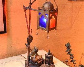 Item 8: Austrian cold painted Orientalist bronze lamp, in the style of Franz Bergman. $1200 No foundry marks or signatures present (green felt removed from base to check). In good condition. Glass appears to be original. One small split in metal on upright - see photo.