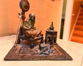 Item 8: Austrian cold painted Orientalist bronze lamp, in the style of Franz Bergman. $1200 No foundry marks or signatures present (green felt removed from base to check). In good condition. Glass appears to be original. One small split in metal on upright - see photo.