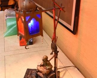 Item 8: Austrian cold painted Orientalist bronze lamp, in the style of Franz Bergman. $1200 No foundry marks or signatures present (green felt removed from base to check). In good condition. Glass appears to be original. One small split in metal on upright - see photo.
