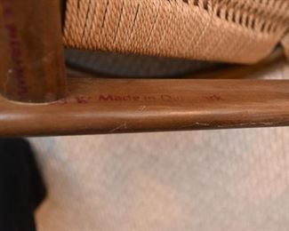 Item 15: Ringstol Chair $500 Stamped "Made in Denmark" in red on underside. All four legs have water damage, as shown.