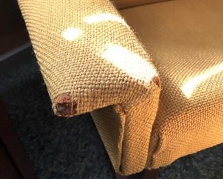 Item 17: Midcentury Lounge Chair & Foot Rest $ 425 Unmarked. Upholstered in yellow loose-weave fabric. The upholstery is soiled and has holes at wear points. Frame of both chair and foot rest are sound.