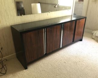Item 22: Rosewood Dresser $185 Rosewood doors with recessed chrome strips, framed in black laminate on wood. Doors open to drawers. Fair condition