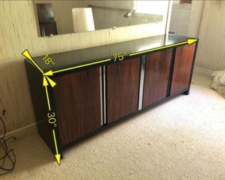 Item 22: Rosewood Dresser $185 Rosewood doors with recessed chrome strips, framed in black laminate on wood. Doors open to drawers. Fair condition