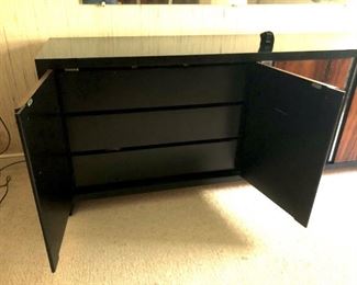 Item 22: Rosewood Dresser $185 Rosewood doors with recessed chrome strips, framed in black laminate on wood. Doors open to drawers. Fair condition