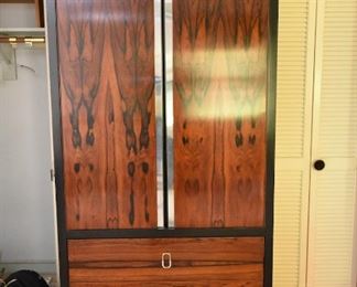 Item 23: Rosewood Wardrobe $250 Rosewood doors with recessed chrome strips. Drawers have chromed pulls. Fair condition