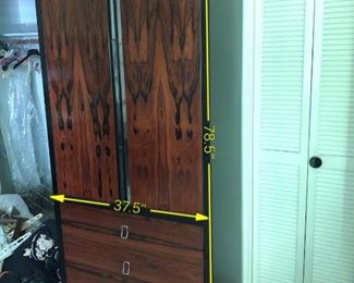 Item 23: Rosewood Wardrobe $250 Rosewood doors with recessed chrome strips. Drawers have chromed pulls. Fair condition