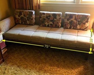 Item 24: Mid Century sectional $345 Platform Sectional sofa with an attached side table. Upholstery is in good condition, although there is a duct tape repair on one arm. Attached side table has a faux wood laminate surface. Frame is sturdy and in good condition.