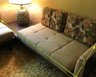 Item 24: Mid Century sectional $345 Platform Sectional sofa with an attached side table. Upholstery is in good condition, although there is a duct tape repair on one arm. Attached side table has a faux wood laminate surface. Frame is sturdy and in good condition.