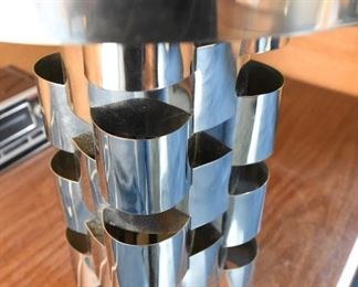 Item 29: Monumental Curtis Jeré Chrome Lamp $385 Minor dings in barrel shade. Base has had paint loss, spot repairs are visible. Some areas of chrome need to be polished after a deep clean.